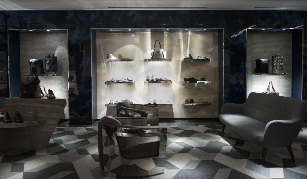 Christian Louboutin's men's section is packed with shoe styles, bags, and accessories. 