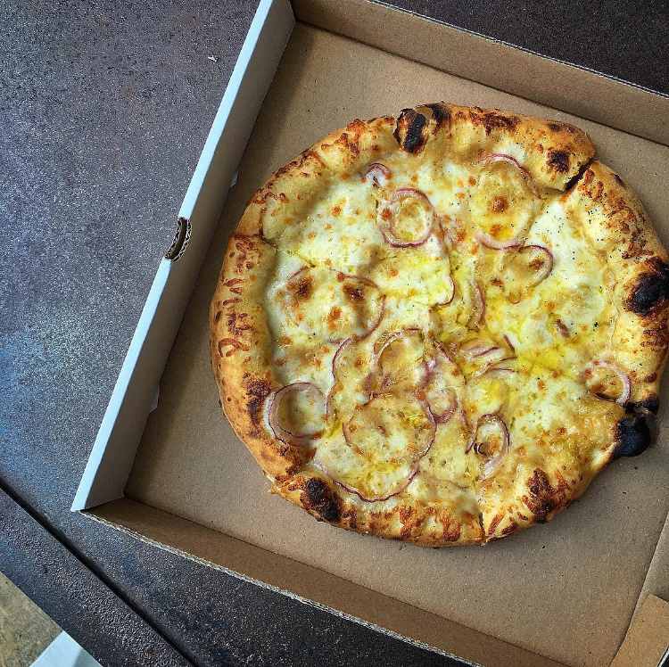 "Smoked Mozzarella, Caramelized Onion & Guanciale: Killer lunch from the @passprovisions team today during our @shakeshack Houston popup. Beyond incredible day!" — @mark_rosati