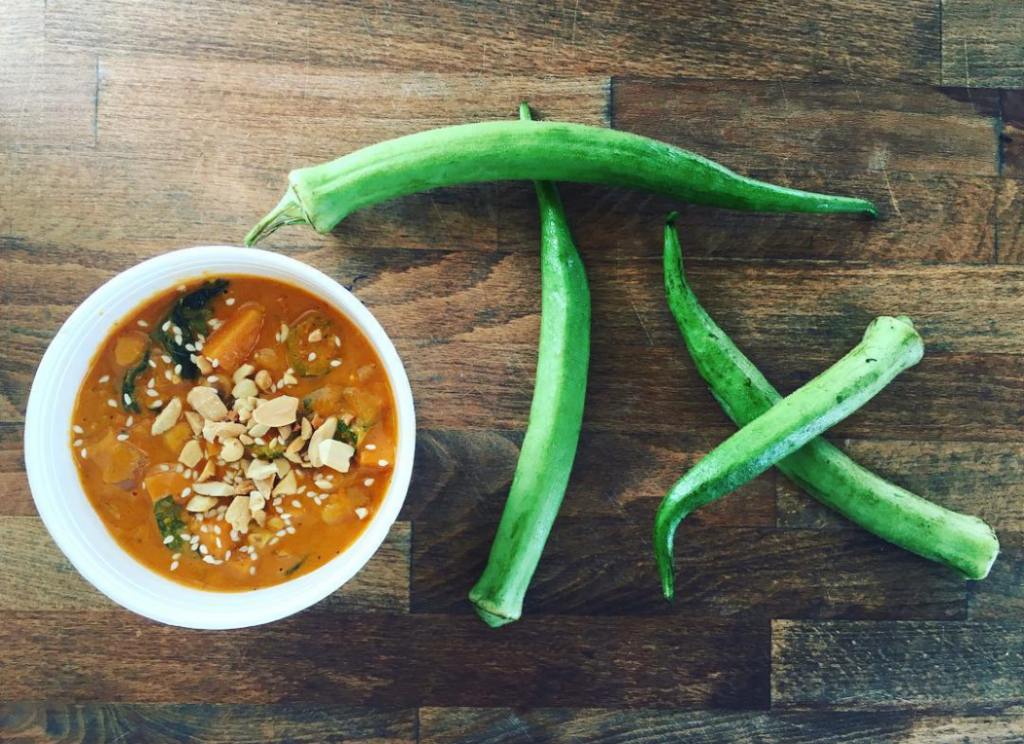 Ripe Cusine's Chick-Peanut Stew is fashioned with spiced tomato peanut broth, sweet potatoes, collard greens, and organic okra sourced from Plant It Forward. 
