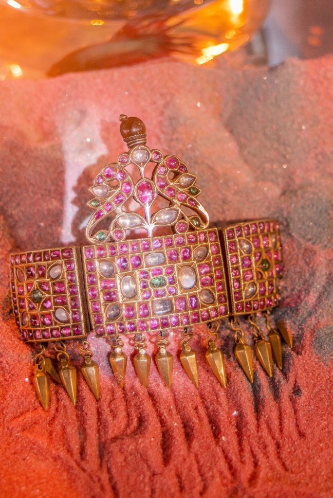 One of a set of Bazubands in 22K gold, with white sapphires, emeralds, and cabochone rubies, normally worn on both arms by a young woman at formal functions, circa early 1900s