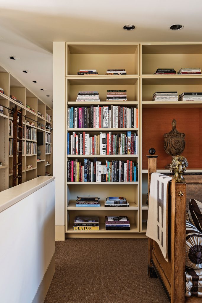 Upstairs, a French reproduction daybed in Clarence house silk from Coté France, Paris. Hermès blanket. Carved urn from J. Randall Powers Associates.
