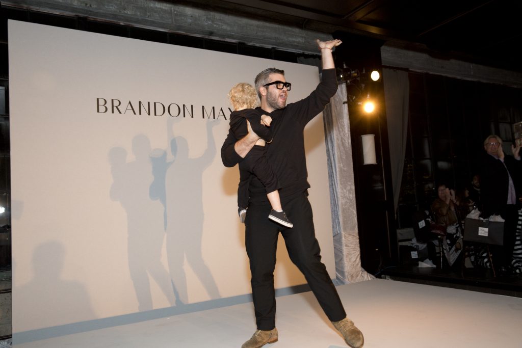 Designer Brandon Maxwell and his young nephew at Catwalk for a Cure