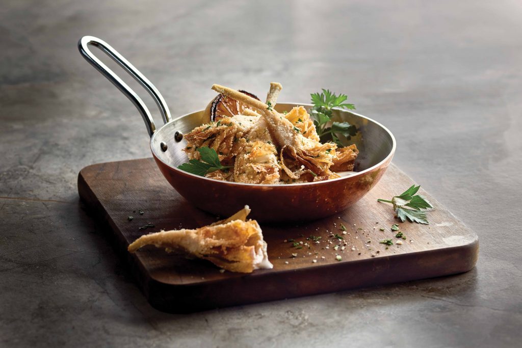 The Carciofi at Grotto features crispy long-stem artichokes with parmesan aioli. 