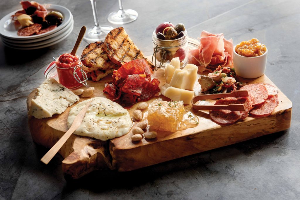 Grotto's chef's board is a great bargain at $35, and features house-made charcuterie and cheeses. 