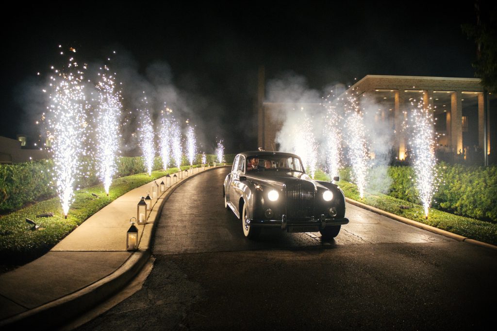 A Rolls-Royce Silver Cloud shuttled the couple from the reception.