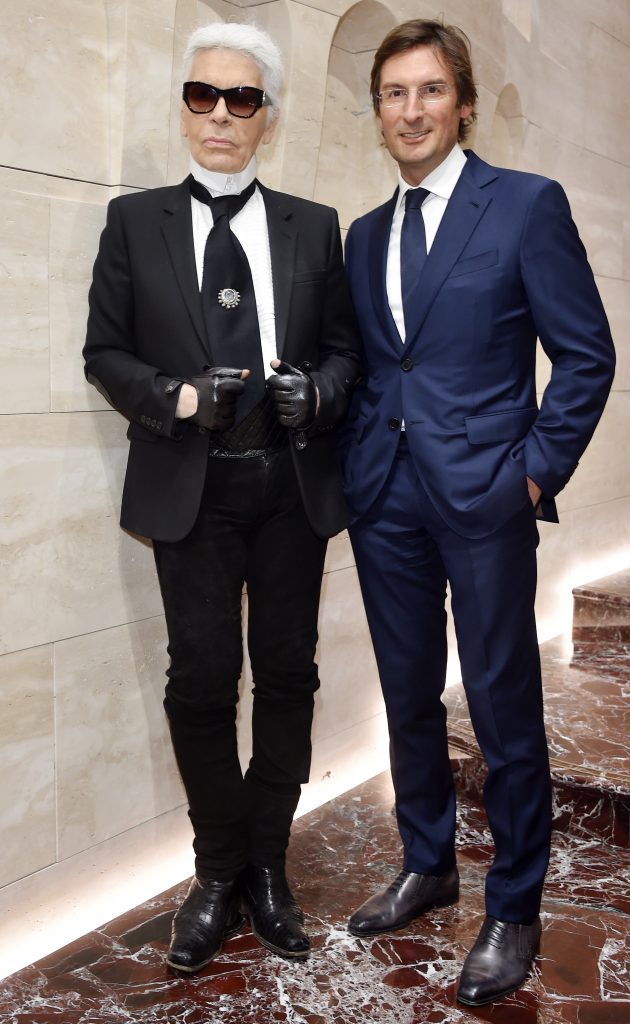 Karl Lagerfeld, with Fendi chairman and CEO Pietro Beccari, at the opening of Palazzo Fendi in Rome