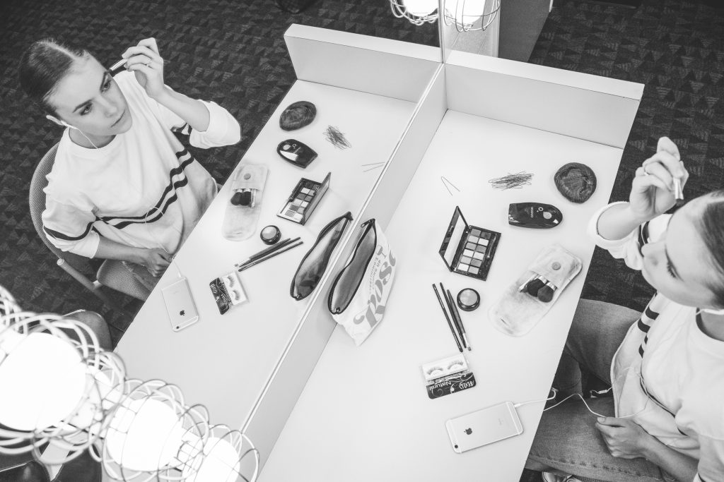 Bridget Kuhns sets out her makeup tools on the table.