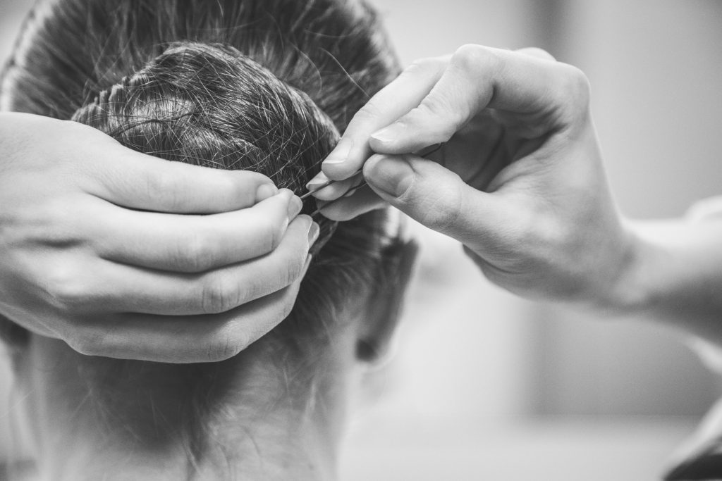 Kuhns pins in her headpiece for Hans van Manen's Grosse Fuge.