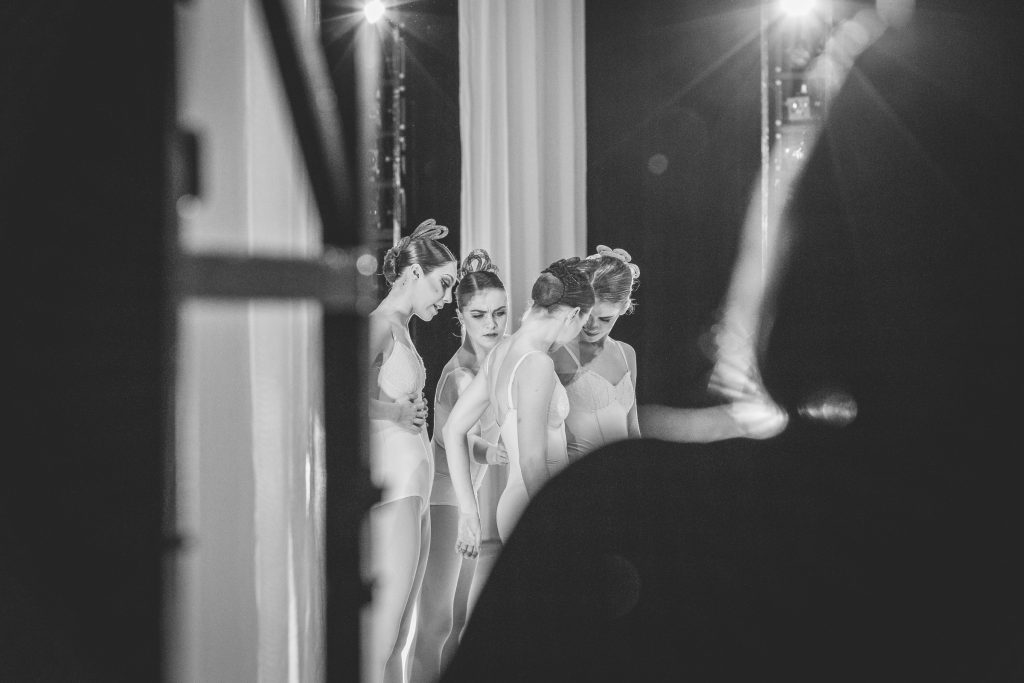 The four women in Hans van Manen's Grosse Fuge help adjust each other's costumes before the curtain rises. 