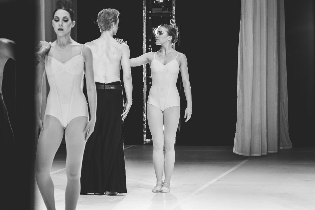 Kuhns looks at her partner onstage while performing a dress rehearsal.