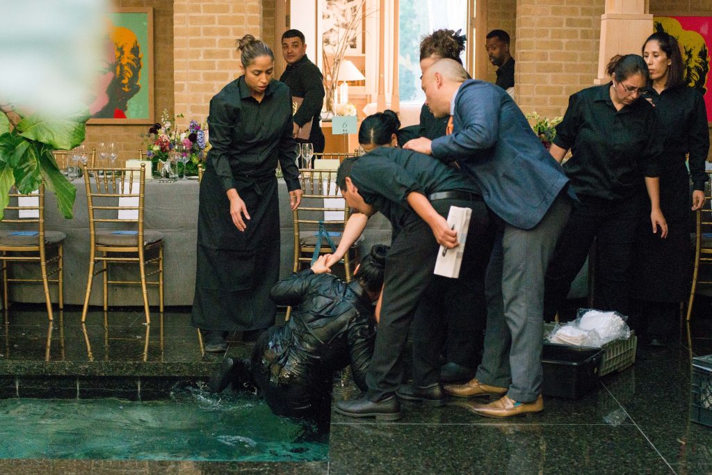 Waiter takes an unplanned dip at a charity benefit in the home of Becca Cason Thrash. (Photo by Michelle Watson)