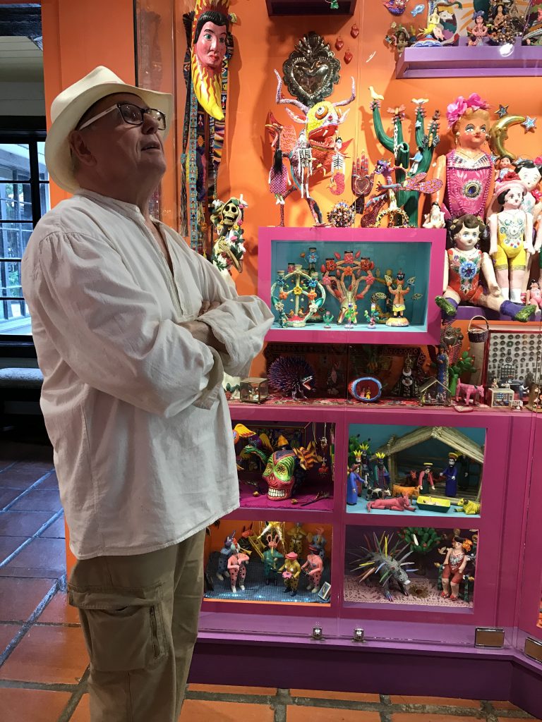 Earl Staley is enchanted with Ann Maddox Moore's colorful and charismatic folk art collection at Quinta Mazatlan. 