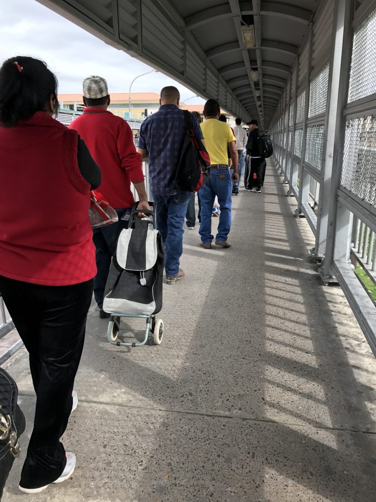 A line awaits crossing the bridge on the way back to the American side. 