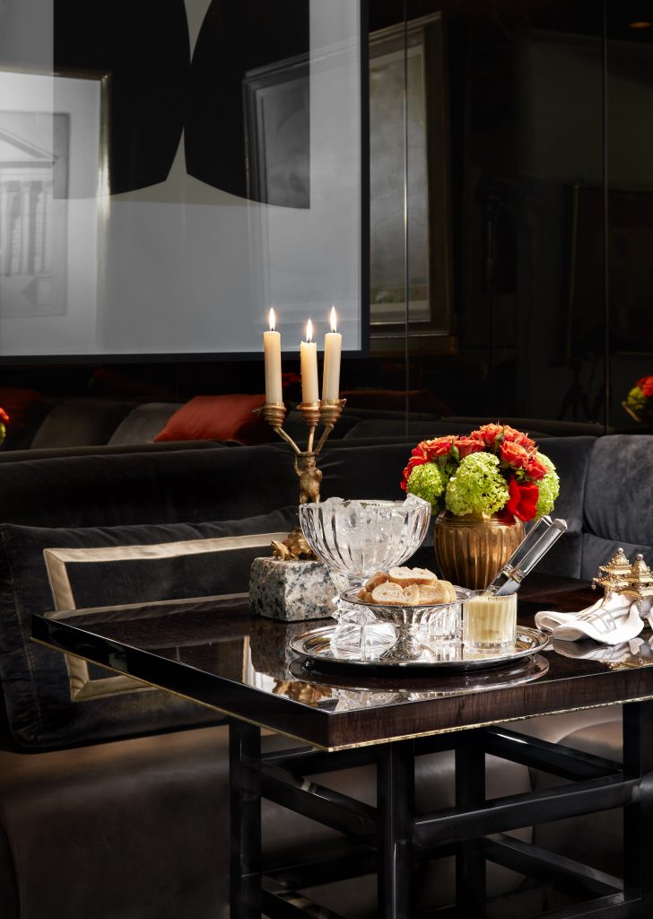 Early 20th-century gold-over-bronze Bavarian candlesticks on granite bases depict bears, snakes, and toads. Baccarat crystal caviar dish and tumblers.