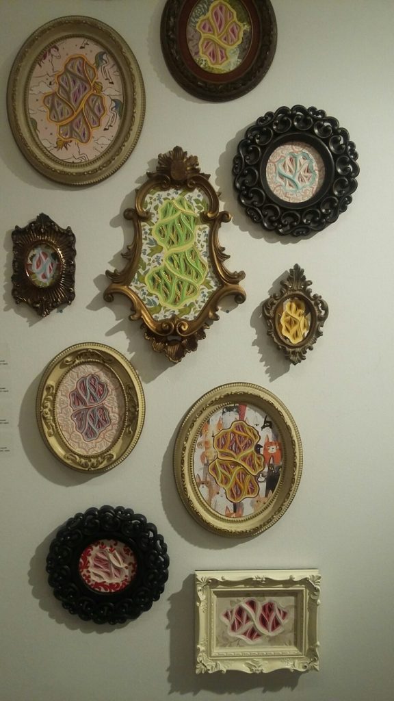 A wall of Charles Clary's captivating carved constructions at Ro2 Art. 