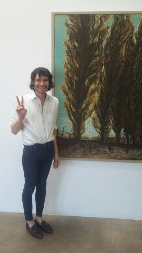 Paul Heil with a Billy Childish canvas at The Goss-Michael Foundation.