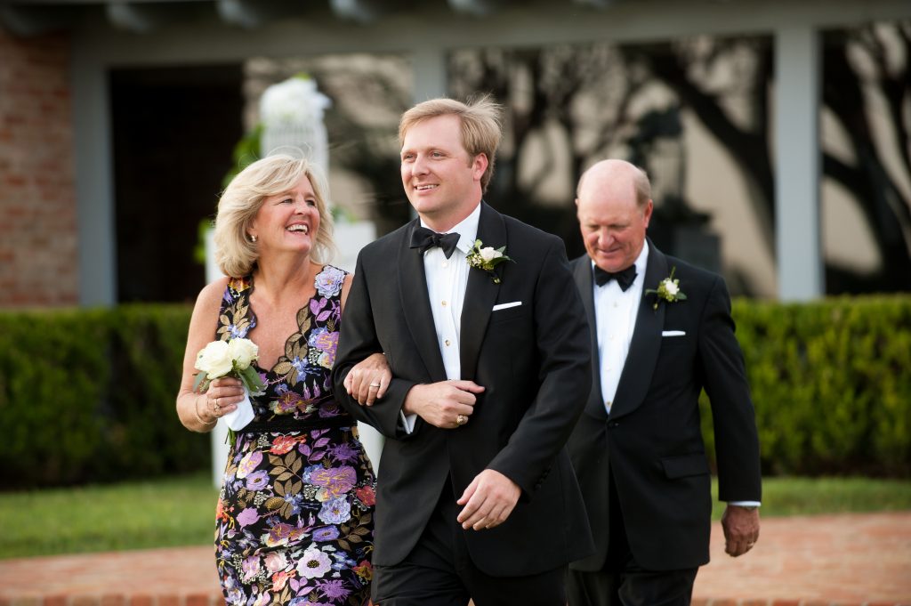 The groom and parents, Lara and Brian Thompson