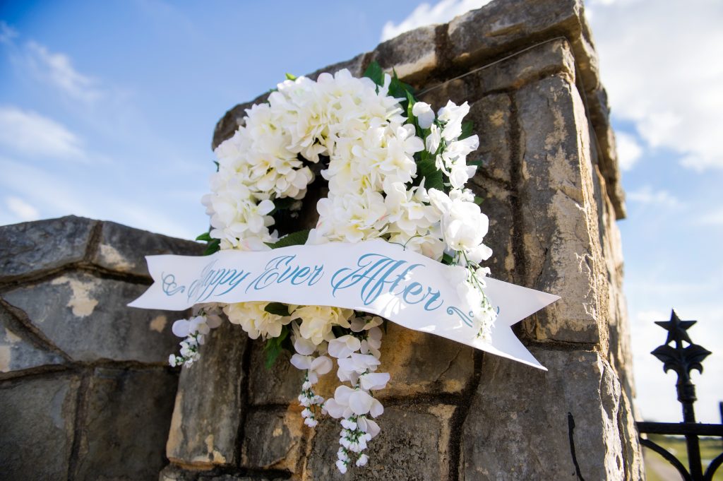 A blossomed banner greets guests at the ranch entrance. 