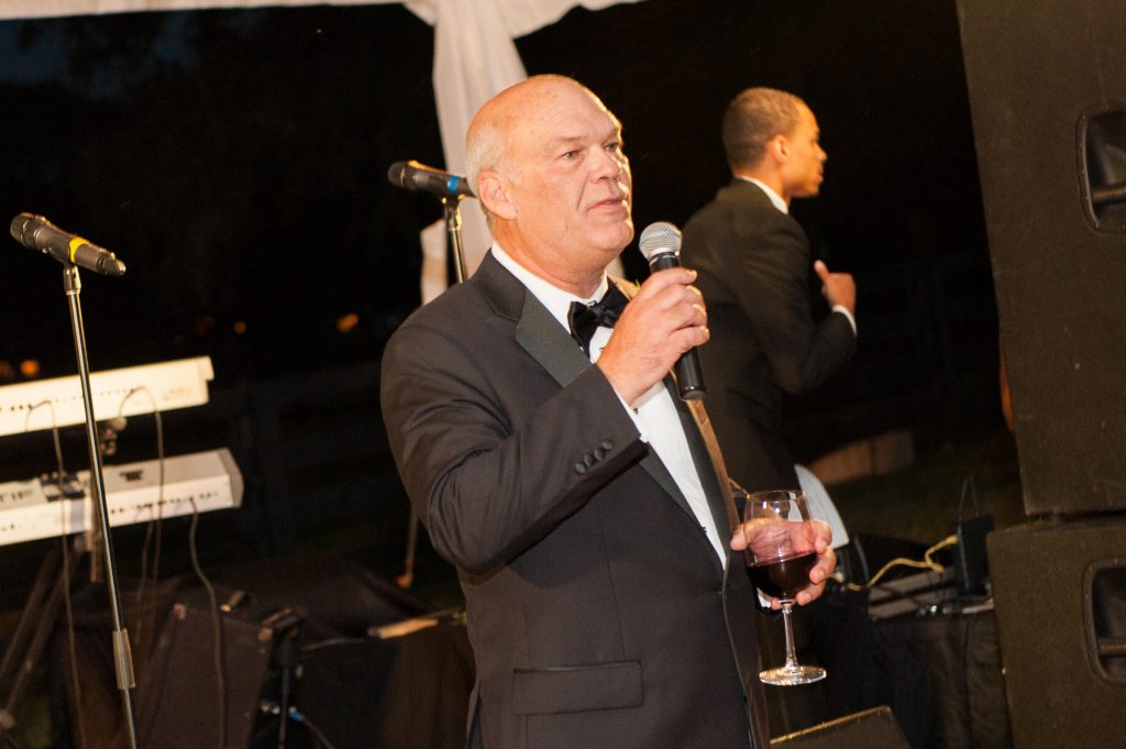 The bride's dad gives a toast.