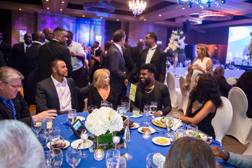 Dak Prescott, Carol Roberts, Ezekiel Elliott enjoy a moment.