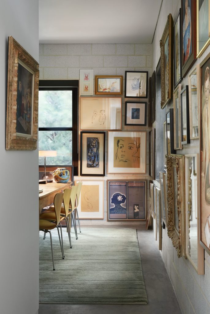 Artwork created by David Griffin and James Ferrara over the decades is hung gallery-style in Griffin’s library. Also included are works by Dallas Museum of Art founder Jerry Bywaters; cabaret performer Julie Wilson; and photographer Karen Buchanan, wife of architect Russell Buchanan; as well as a circa-1970 Griffin family portrait by Gittings. Eighteenth-century oak table. Contemporary Venetian library lamp. Vintage Arne Jacobson chairs. Tufenkian rug.