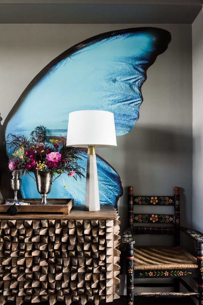 In the atrium entryway, butterfly wall applique by Pixers; QS New York sideboard from Noirfurniturela; concrete tapered table lamps, Rejuvenation. (photo by Manny Rodriguez) (Photo by Manny Rodriguez)