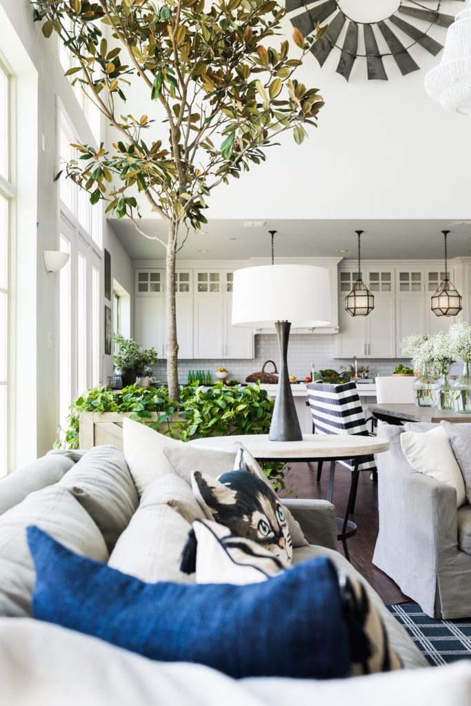 The living-kitchen area and family
room, with reclaimed farm windmill from White Elephant Antiques (Photo by Manny Rodriguez)
