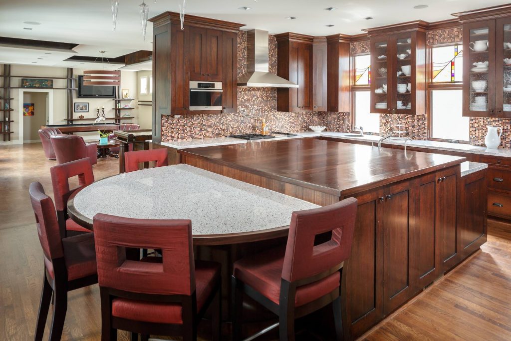 Warm tones and an oversized island make for an inviting kitchen.