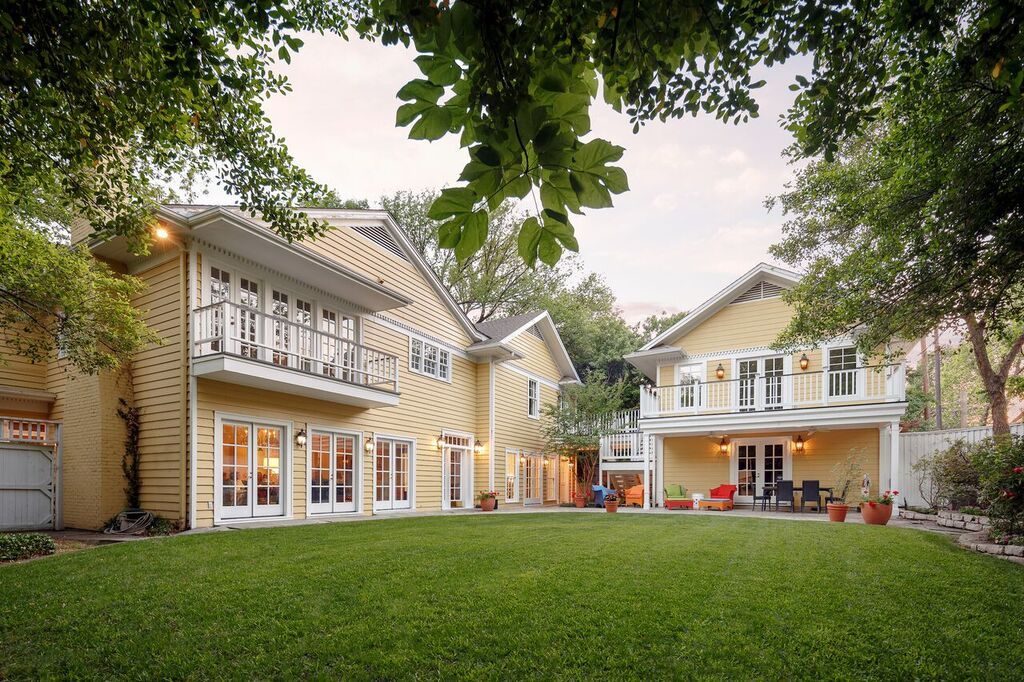 The roomy backyard, complete with two balconies and a guest house. 