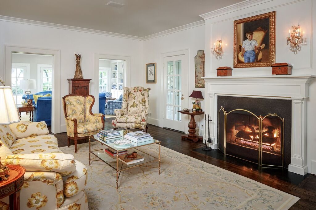 One of the home's living areas with an elegant mantle. 