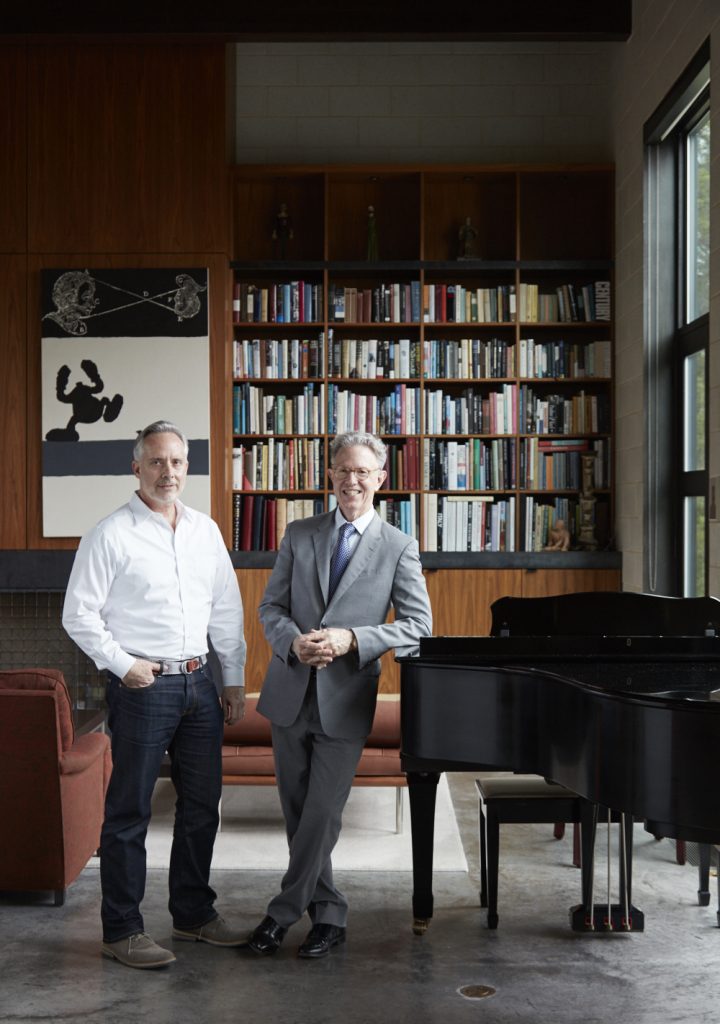 From left, James Ferrara and David Griffin. The grand piano was one of Griffin’s first acquisitions after college in the 1980s.