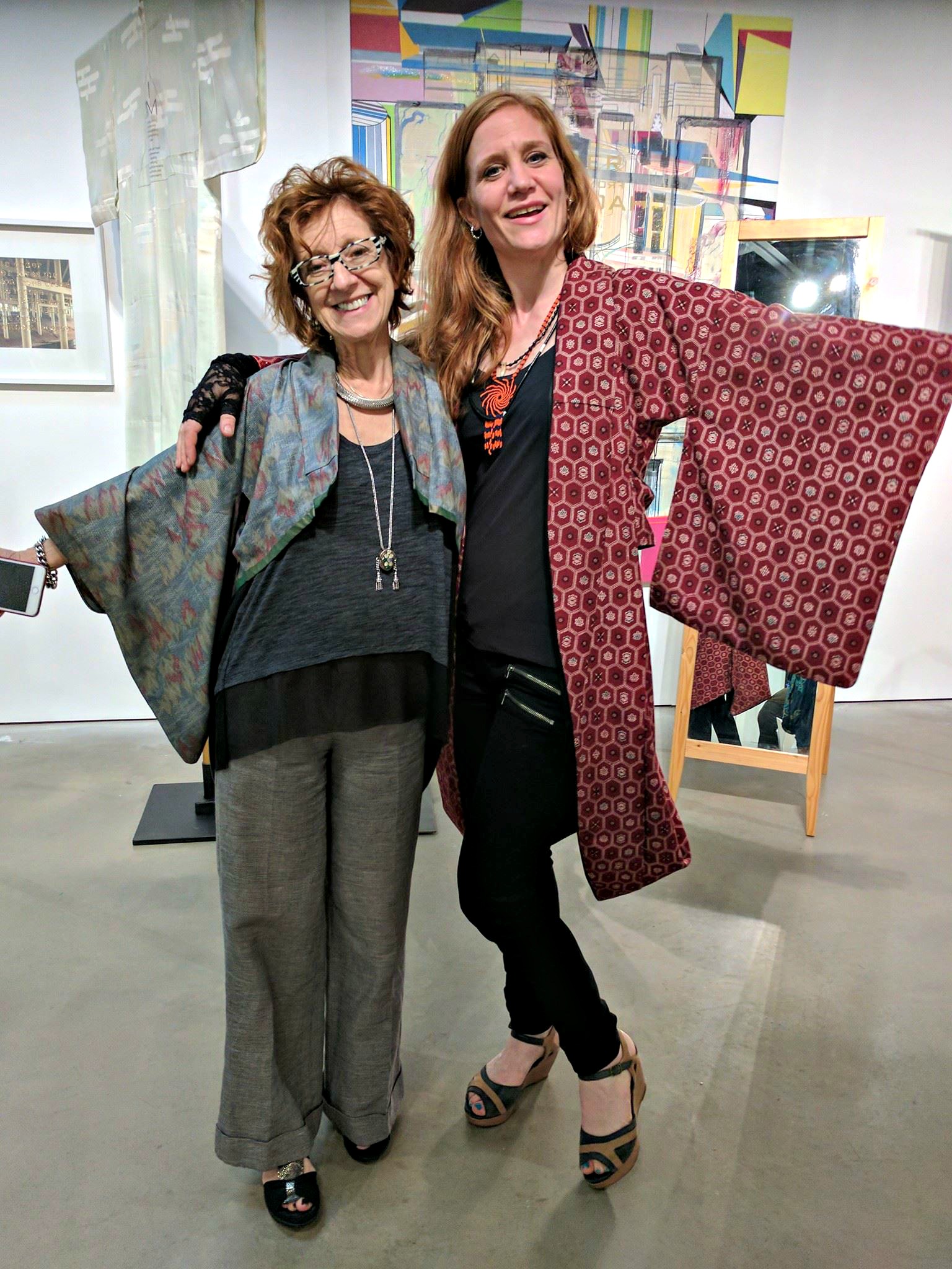 Gallerist Anya Tish and artist Katja Loher sport Kimono Zulu fashions.