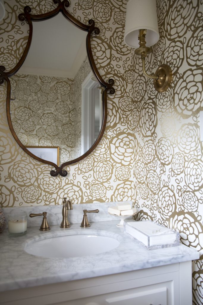 The powder room, renovated in collaboration with Lowe's. Oh Joy! Petal Pusher wallpaper.