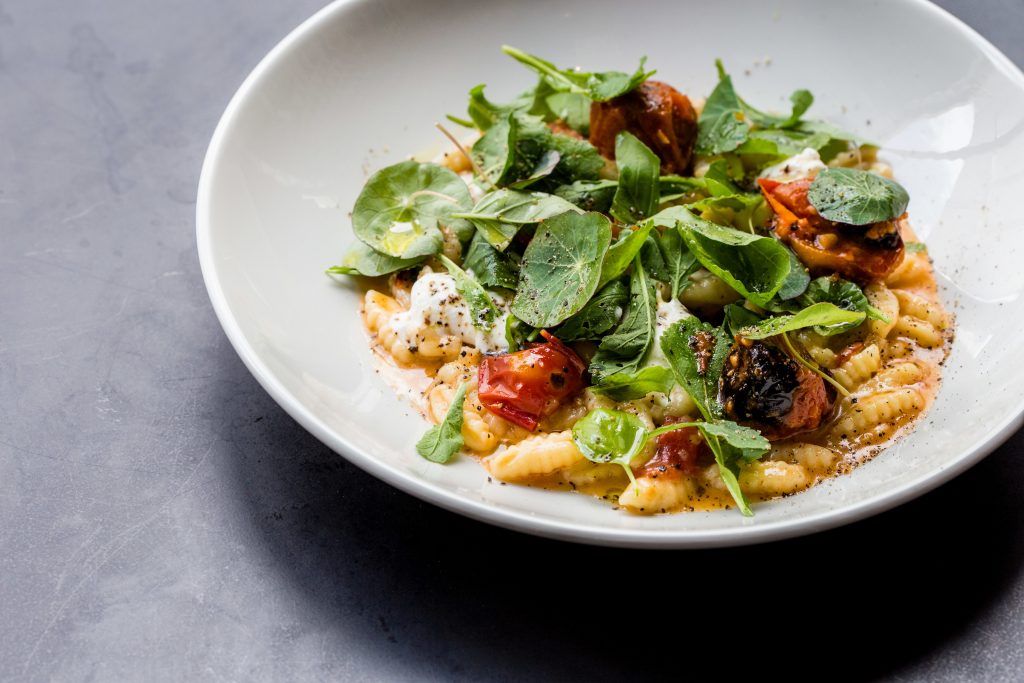 House-made cavatelli pasta with tomato, burrata, nasturtium, and smoked butter