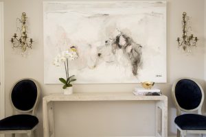 An oversized painting by Saba Jawda in the living room.