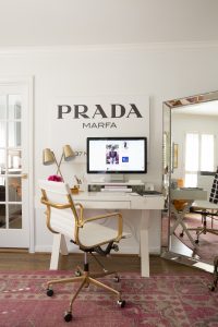 Prada Marfa art resides over the desk where Knapp writes her popular blog. Selfie mirror to the right.