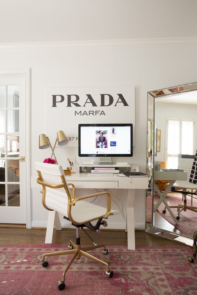 Prada Marfa art resides over the desk where Knapp writes her popular blog. Selfie mirror to the right.