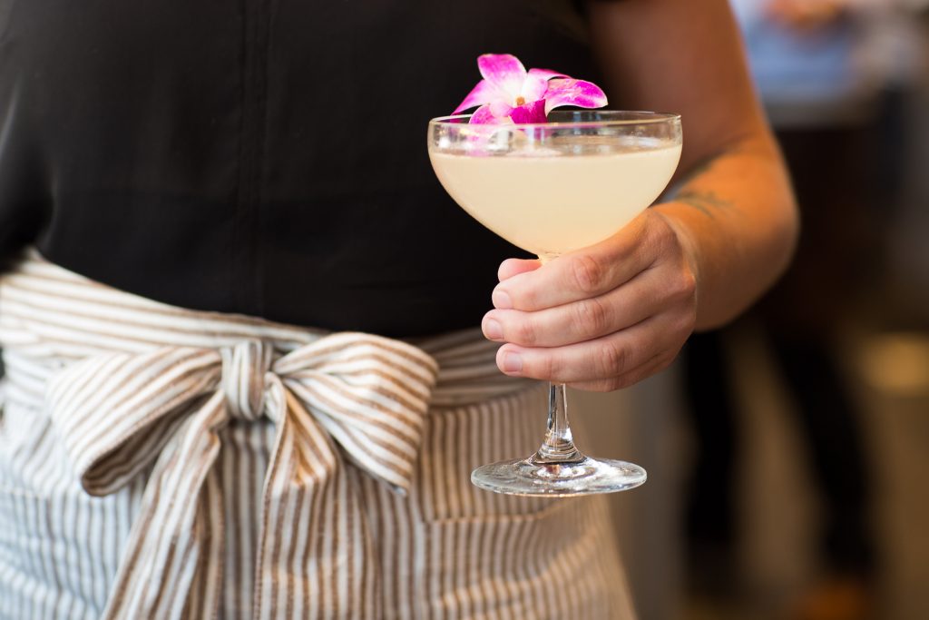 The restaurant features a full bar with cocktails, wine, and beer.