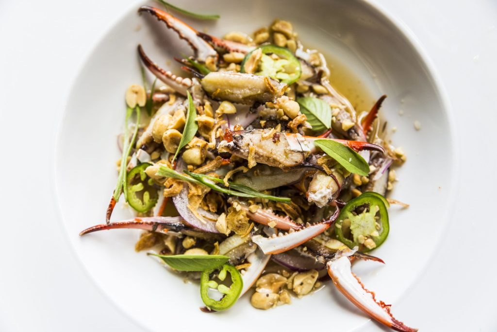 The Nuoc Cham Marinated Crab Fingers at Underbelly are mixed with crushed peanuts, onions, and herbs. 