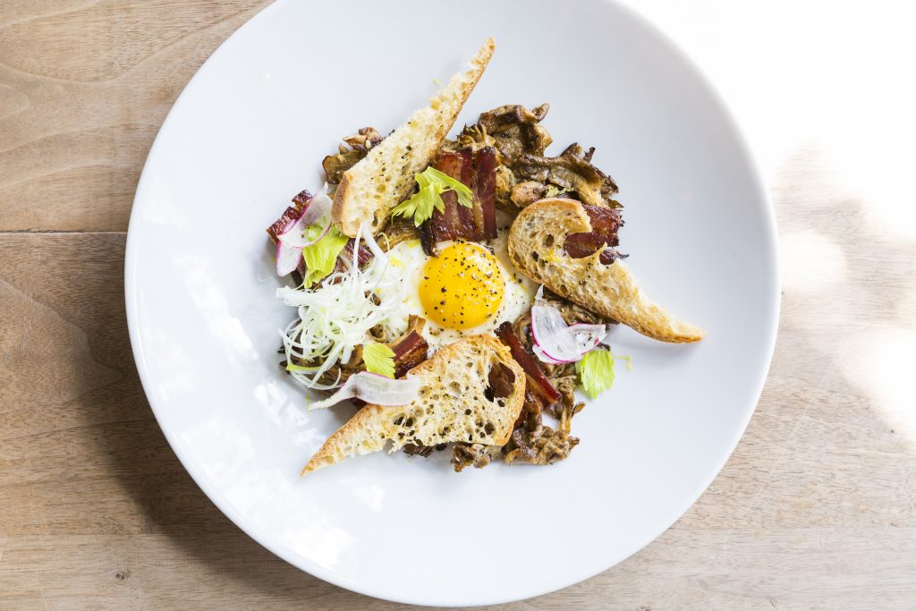 Roasted mushrooms with bacon, egg, and toast