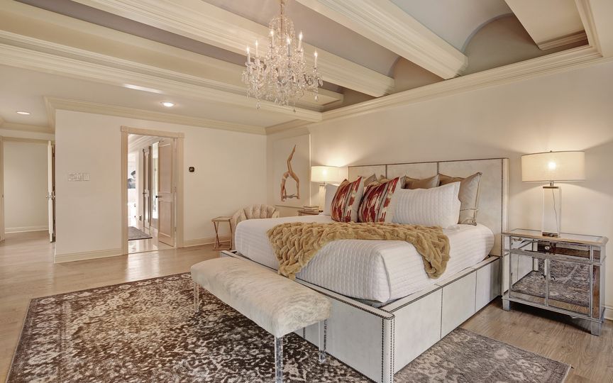 Barrel vault ceilings add interest to the master bedroom. 