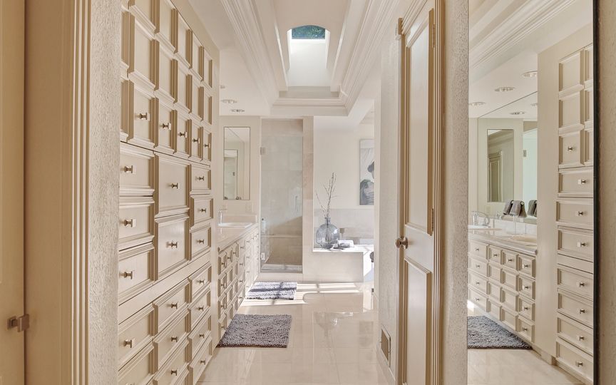 There's room for plenty of fedoras in the master closet. 