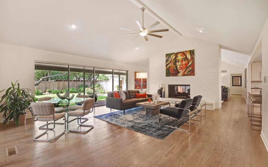 Walls of windows spill natural light into the home. 