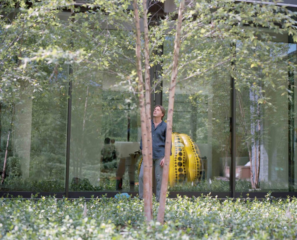 A Kusama pumpkin resides in a private collection in Houston. Shown: landscape master Luciano Giubbilei, the designer of the grounds of the private retreat whose sculpture garden features the Kusama. (Photo Max Burkhalter)