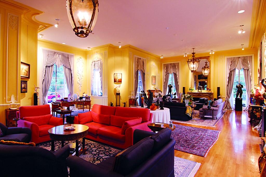 The main living room, with its pale yellow halls, once held one of the world's most celebrated collections of Art Nouveau furnishings, especially Bugatti furniture and Tiffany lamps.