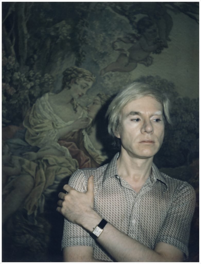 Andy Warhol wearing his Tank watch in a self portrait.