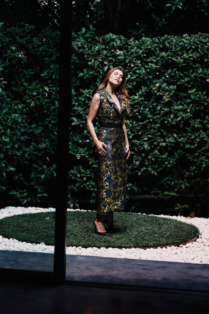 Cockrell in an Erdem sleeveless coat $3,210, at Forty Five Ten.