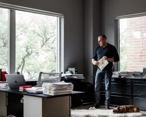 Contemplating research in a corner of a light-washed apartment transformed into a scholar’s office. Middleton based himself in Houston for more than 10 years, to conduct interviews and be near archives at The Menil Collection, and other primary source materials to gain insight into his subjects' lives. French bulldog Hubert, a muse for the author during his arduous writing process. (Photo Max Burkhalter)