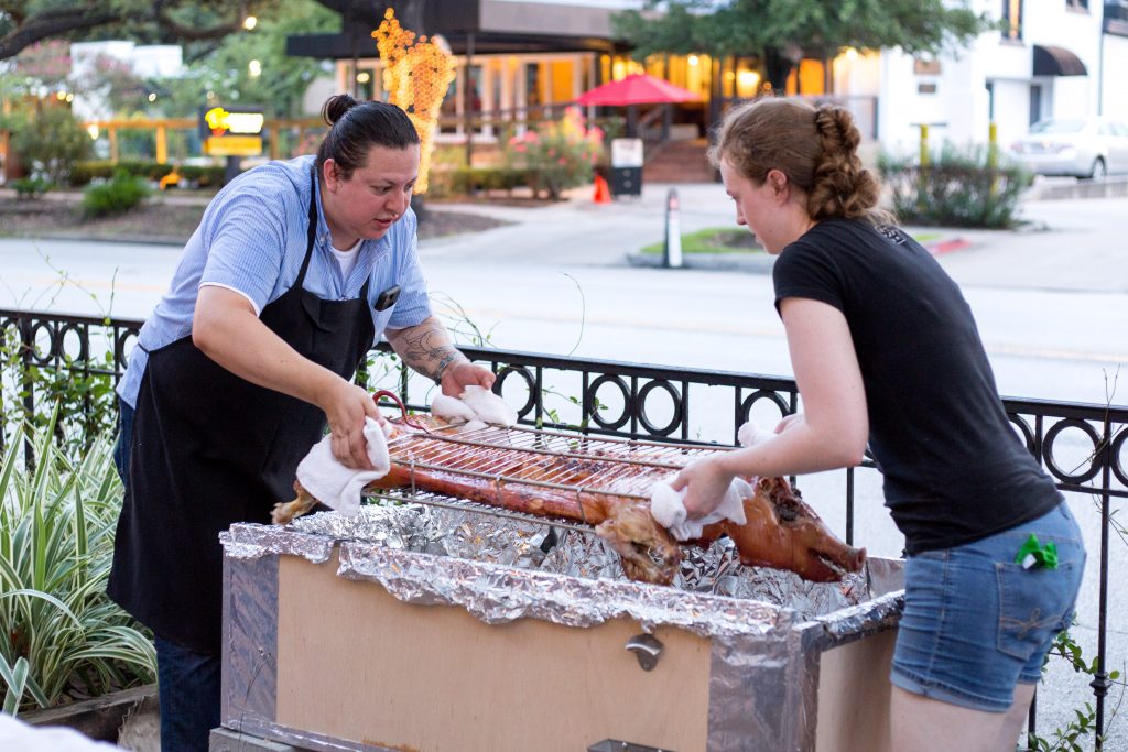Edgar Hernandez and Martha De Leon flip the pig. 