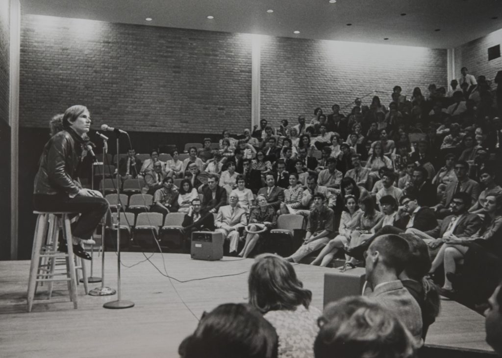 Andy Warhol and his Factory Superstar Viva, draw a packed house at the University of St. Thomas auditorium, Houston, 1968. (Courtesy Menil Archives, The Menil Collection, PhotoHickey-Robertson)
